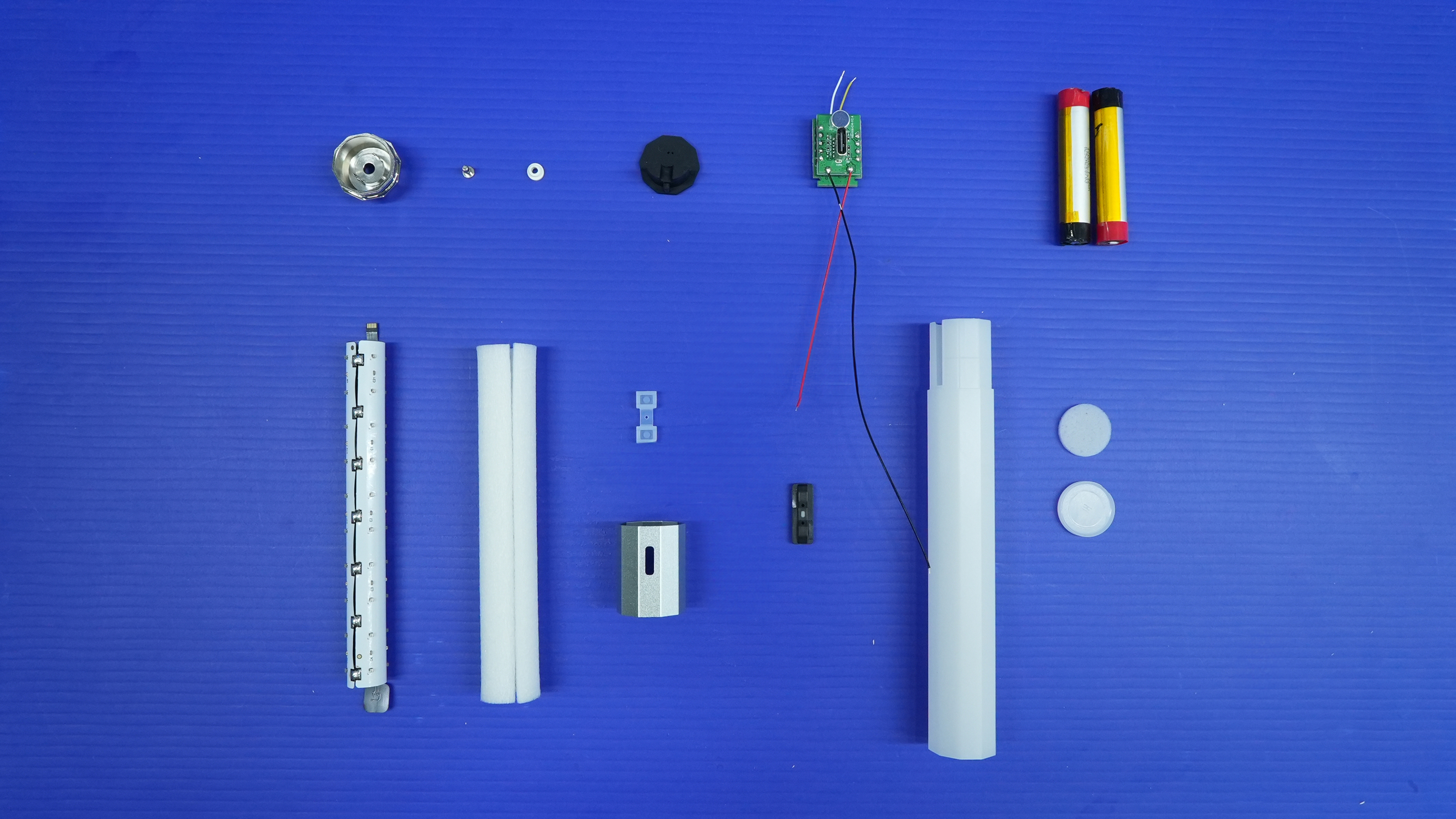 Litsaber components laid out for assembly