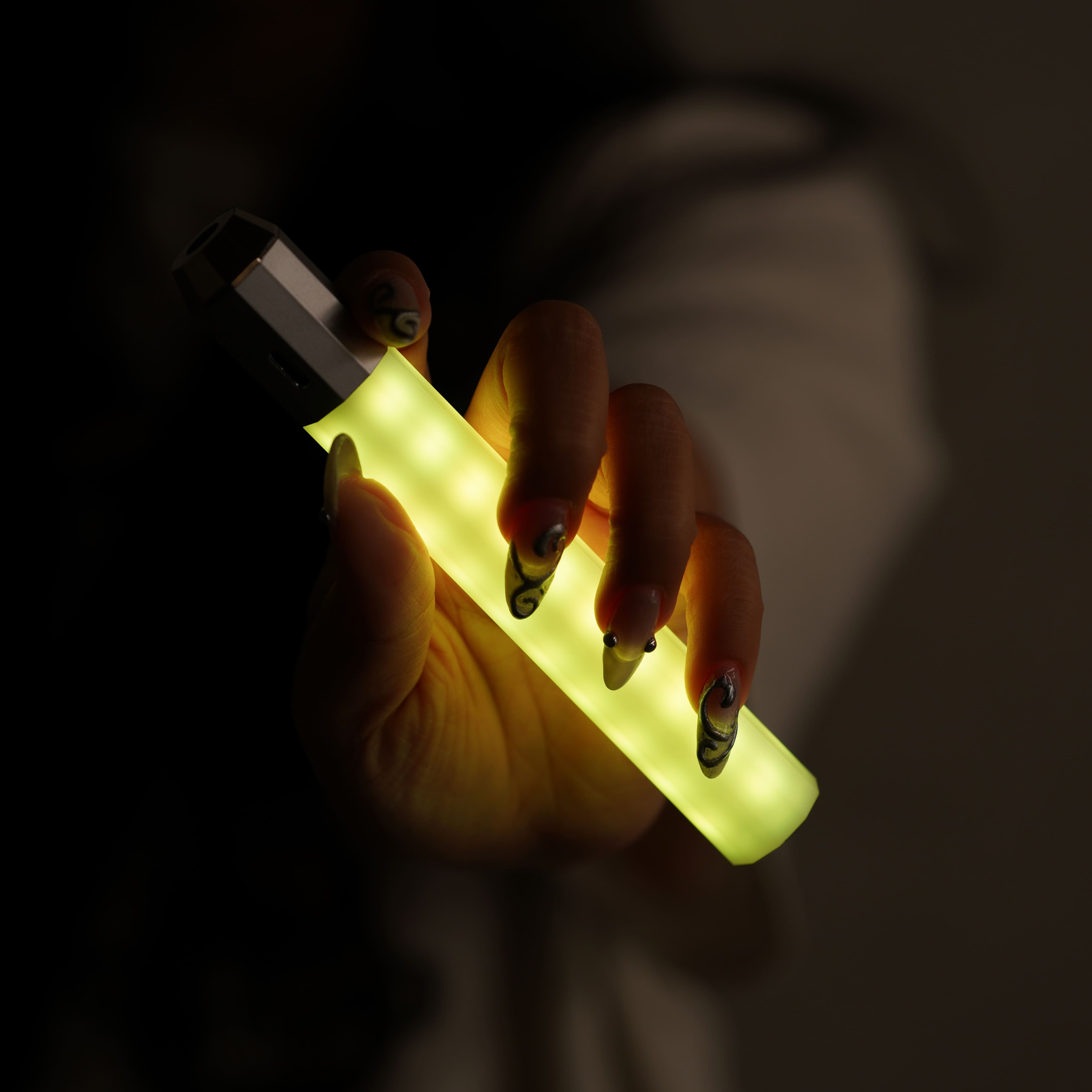 Litsaber in yellow handheld