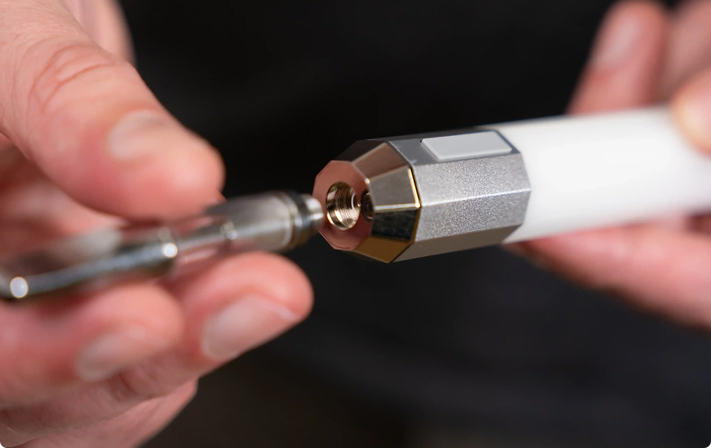 Litsaber held in hand, LED lit to indicate voltage setting